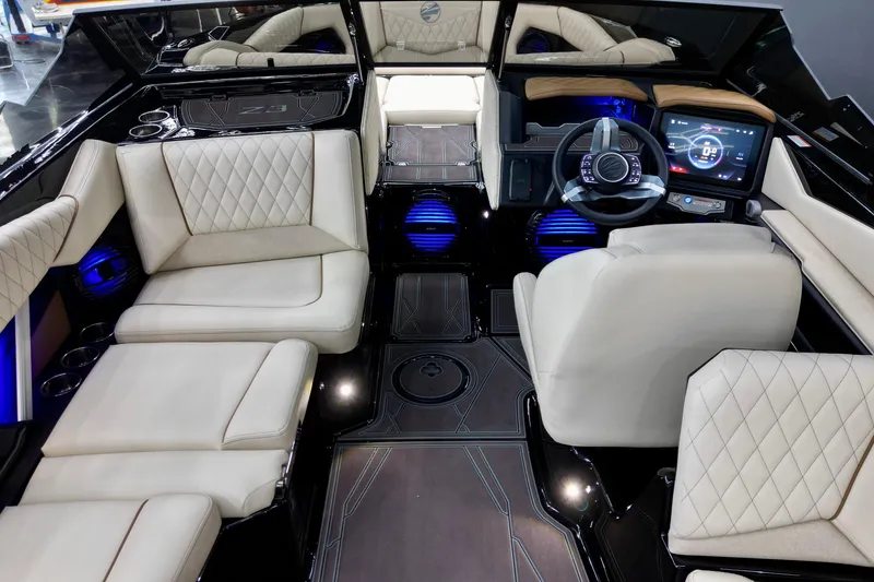 Slide: The Image of Luxurious interior of 2026 Tigé Z3 boat with plush seating and modern dashboard. - 7