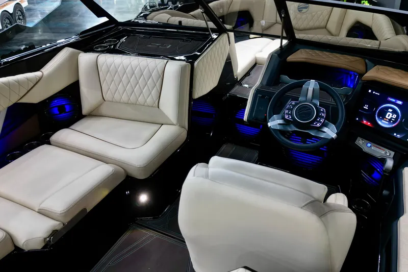 Slide: The Image of 2026 Tigé Z3 boat dashboard with modern steering wheel and digital display. - 9