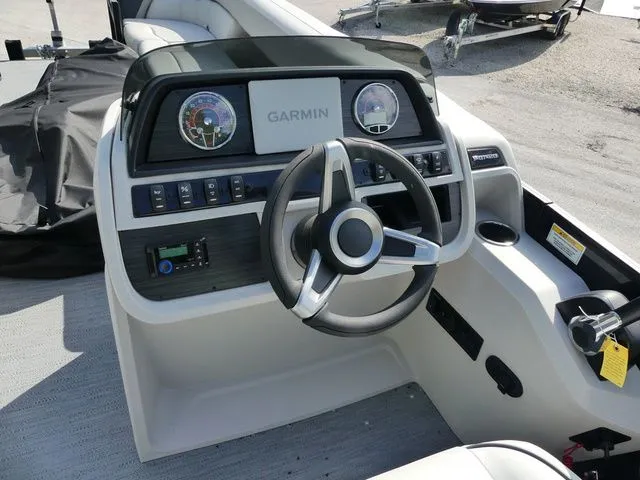 Slide: The Image of Godfrey Pontoons Sweetwater 2486 SFL 2026 helm with Garmin system. - 7