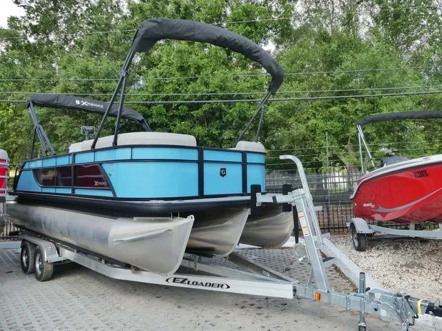 The Image of 2026 Godfrey Pontoons Xperience 2086 SFLX on trailer, blue design. - 1
