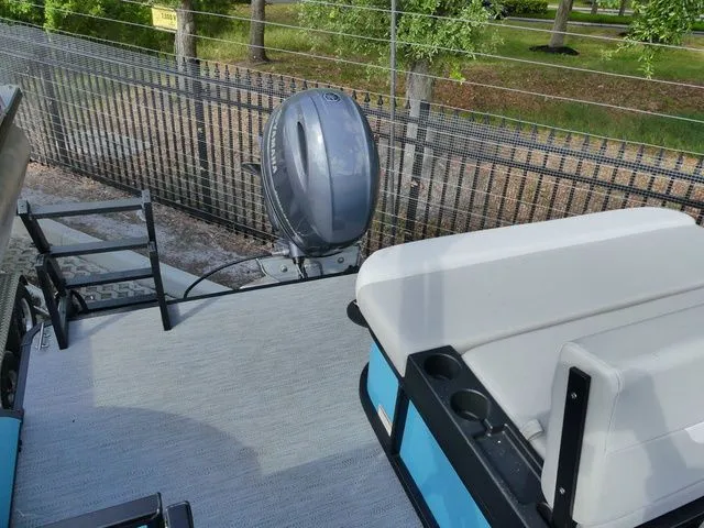 Slide: The Image of Godfrey Pontoons Xperience 2086 SFLX 2026 with outboard motor and seating area. - 4