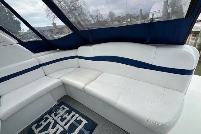Slide: The Image of 2005 Formula 37 Performance Cruiser interior with white seating and blue accents. - 12