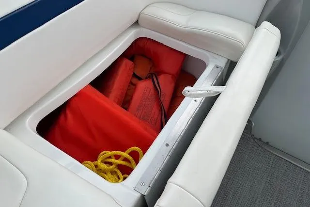 Slide: The Image of Storage compartment in 2005 Formula 37 Performance Cruiser with life jackets and rope. - 18