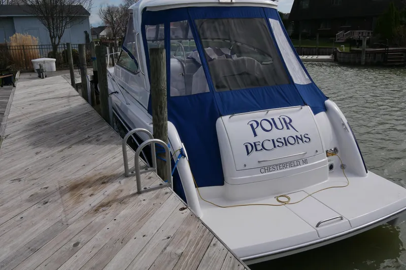 Slide: The Image of 2005 Formula 37 Performance Cruiser docked, featuring "Pour Decisions" name, Chesterfield, MI. - 2