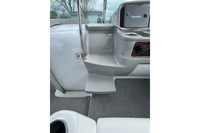 Slide: The Image of 2005 Formula 37 Performance Cruiser interior with Raymarine equipment and sleek gray design. - 20