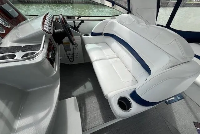 Slide: The Image of 2005 Formula 37 Performance Cruiser interior with white seating and steering console. - 22