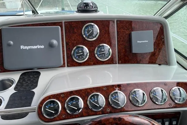 Slide: The Image of Dashboard of a 2005 Formula 37 Performance Cruiser with Raymarine navigation equipment. - 25