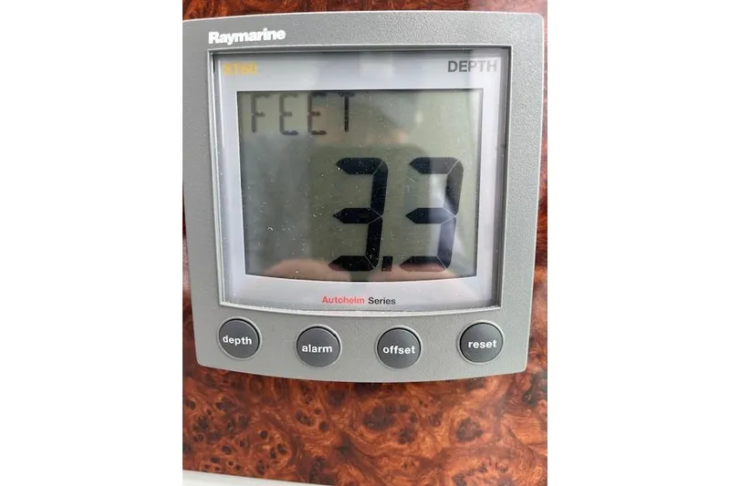 Slide: The Image of Raymarine depth gauge displaying 3.3 feet on a 2005 Formula 37 Performance Cruiser. - 29
