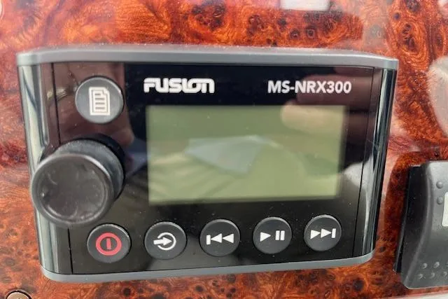 Slide: The Image of Fusion MS-NRX300 marine stereo control on 2005 Formula 37 Performance Cruiser dashboard. - 31
