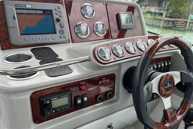 Slide: The Image of Control panel of a 2005 Formula 37 Performance Cruiser with navigation and gauges. - 35