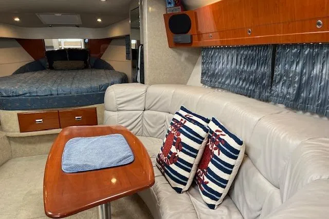 Slide: The Image of 2005 Formula 37 Performance Cruiser interior with cozy seating and nautical-themed decor. - 39
