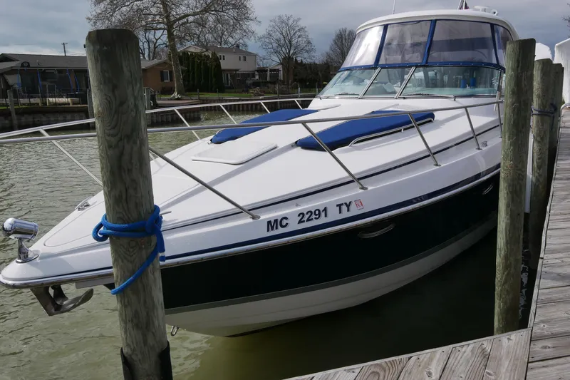 Slide: The Image of 2005 Formula 37 Performance Cruiser docked at a marina, side view. - 4