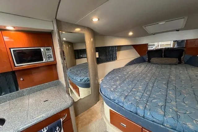 Slide: The Image of Interior of 2005 Formula 37 Performance Cruiser with bed, kitchenette, and microwave. - 46