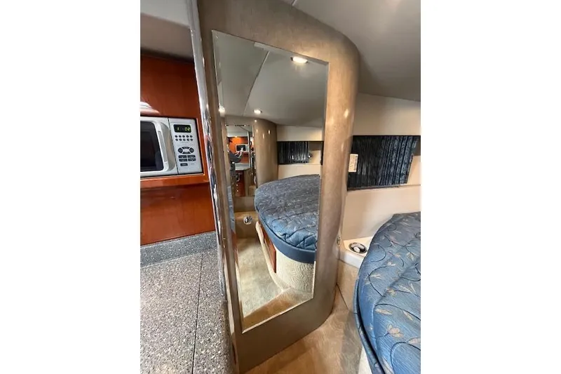 Slide: The Image of Interior of 2005 Formula 37 Performance Cruiser with bed, mirror, and kitchenette. - 47