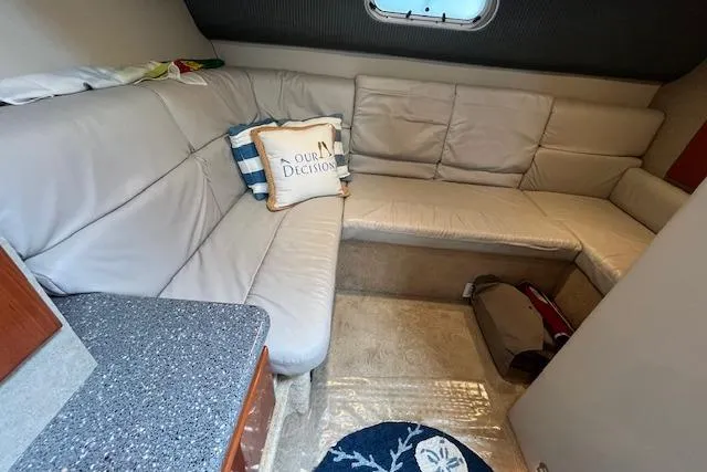 Slide: The Image of 2005 Formula 37 Performance Cruiser interior with beige leather seating and decorative pillows. - 49