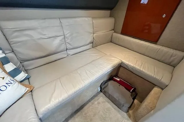 Slide: The Image of Interior of 2005 Formula 37 Performance Cruiser with beige leather seating and wooden accents. - 50