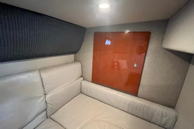 Slide: The Image of Interior of 2005 Formula 37 Performance Cruiser with beige seating and wooden paneling. - 51