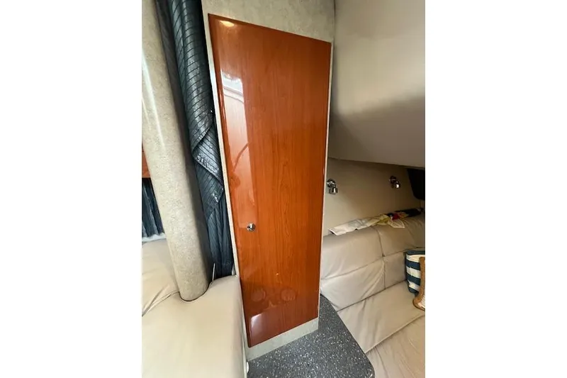 Slide: The Image of Interior of 2005 Formula 37 Performance Cruiser with wooden door and cozy seating area. - 53