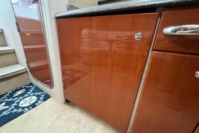 Slide: The Image of Interior of 2005 Formula 37 Performance Cruiser with wooden cabinetry and carpeted flooring. - 59