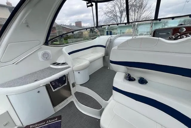 Slide: The Image of 2005 Formula 37 Performance Cruiser interior with white seating and modern dashboard. - 7