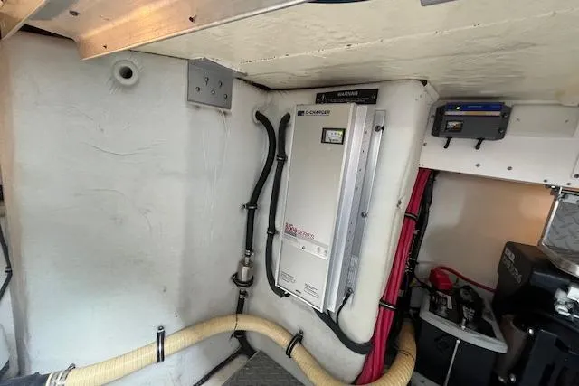 Slide: The Image of Engine room of a 2005 Formula 37 Performance Cruiser with electrical components and wiring. - 72