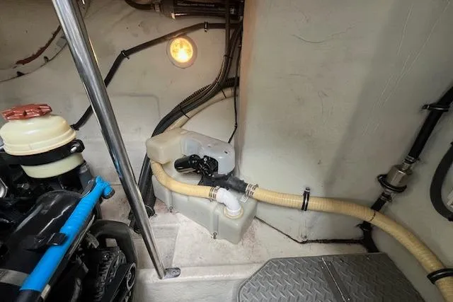 Slide: The Image of Engine compartment of a 2005 Formula 37 Performance Cruiser with visible hoses and components. - 73