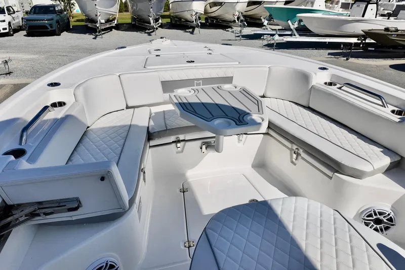 Slide: The Image of Luxurious seating area on a 2026 Sea Fox 282 Hybrid LT boat, featuring quilted upholstery. - 10