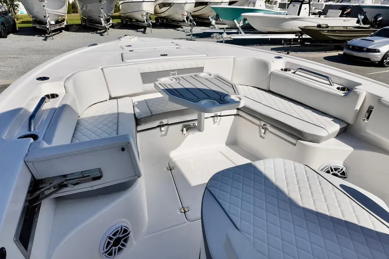 Slide: The Image of 2026 Sea Fox 282 Hybrid LT boat interior with cushioned seating and table. - 11