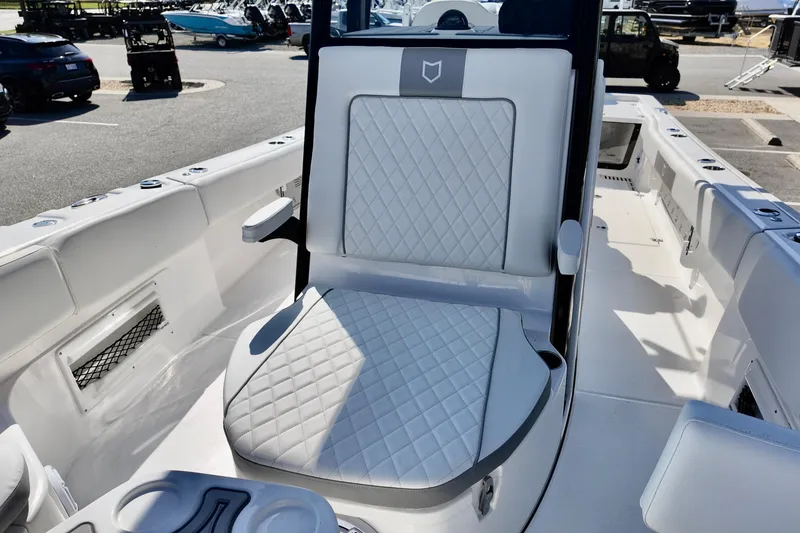 Slide: The Image of 2026 Sea Fox 282 Hybrid LT boat interior with diamond-stitched seating and cup holders. - 15