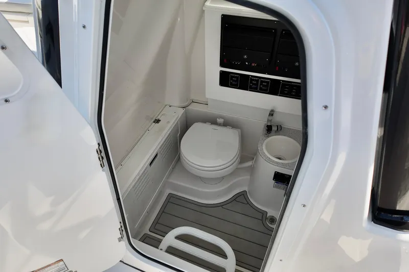 Slide: The Image of Interior of 2026 Sea Fox 282 Hybrid LT boat bathroom with toilet and sink. - 17