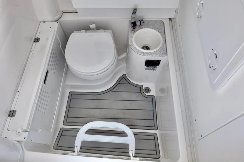 Slide: The Image of 2026 Sea Fox 282 Hybrid LT boat bathroom with toilet and sink. - 18