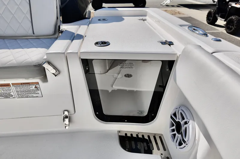 Slide: The Image of 2026 Sea Fox 282 Hybrid LT boat interior with storage compartment and speaker. - 22