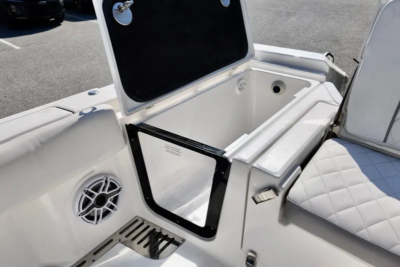 Slide: The Image of 2026 Sea Fox 282 Hybrid LT boat interior with storage compartment and speaker. - 24