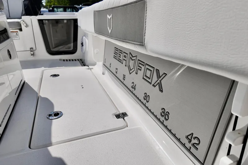 Slide: The Image of 2026 Sea Fox 282 Hybrid LT boat interior with branded seating and measurement markings. - 27