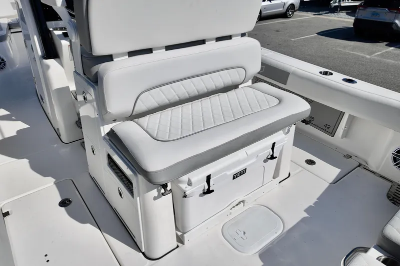 Slide: The Image of 2026 Sea Fox 282 Hybrid LT boat interior with cushioned seating and storage. - 29