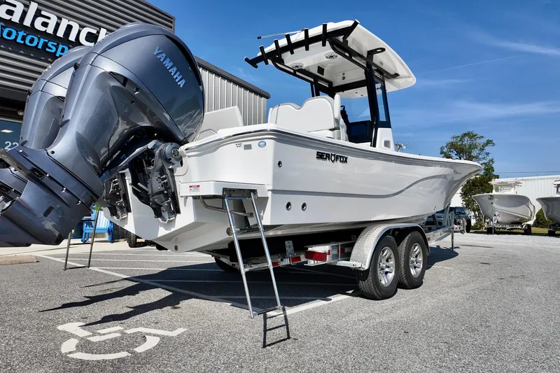 Slide: The Image of 2026 Sea Fox 282 Hybrid LT boat on trailer, featuring Yamaha outboard motor. - 3