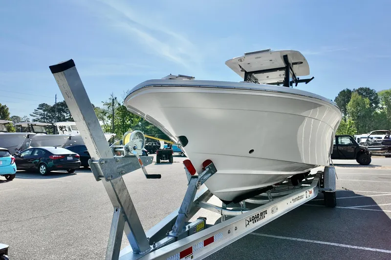 Slide: The Image of 2026 Sea Fox 282 Hybrid LT boat on trailer in parking lot, sunny day. - 7