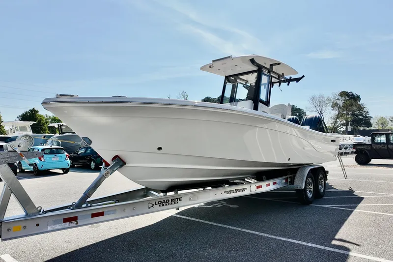 Slide: The Image of 2026 Sea Fox 282 Hybrid LT boat on trailer in parking lot. - 8