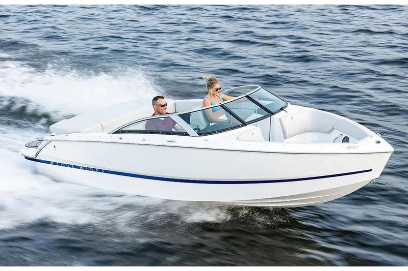 Slide: The Image of Manufacturer Provided Image: 2026 Four Winns H1 Freedom boat cruising on open water with two passengers. - 9