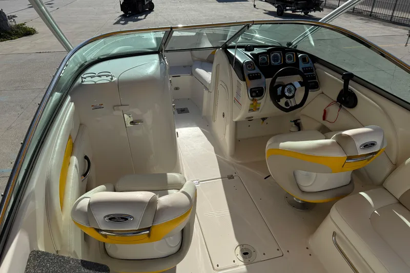 Slide: The Image of Interior of a 2008 Chaparral 236 SSX boat with white and yellow seating. - 11