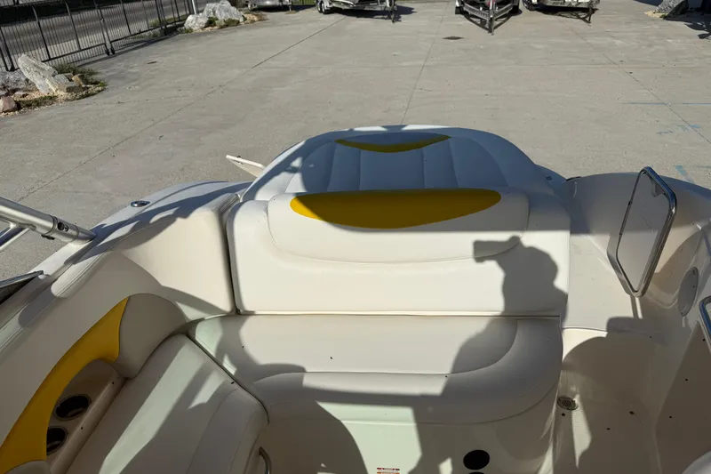 Slide: The Image of 2008 Chaparral 236 SSX boat interior with white and yellow seating. - 12
