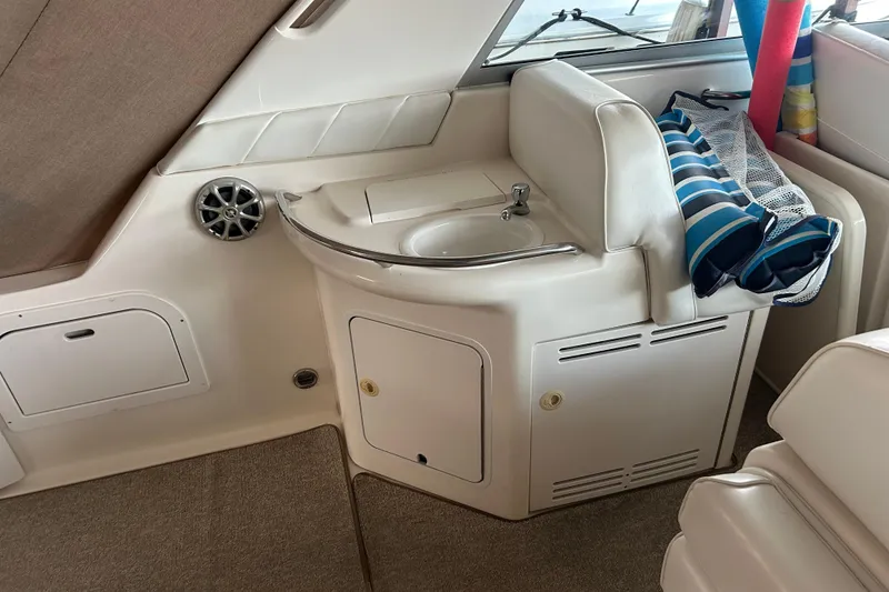 Slide: The Image of Interior of a 1997 Sea Ray Sundancer 330 yacht with sink and storage area. - 18