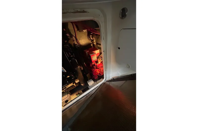 Slide: The Image of Engine compartment of a 1997 Sea Ray Sundancer 330 boat, showing mechanical components. - 34