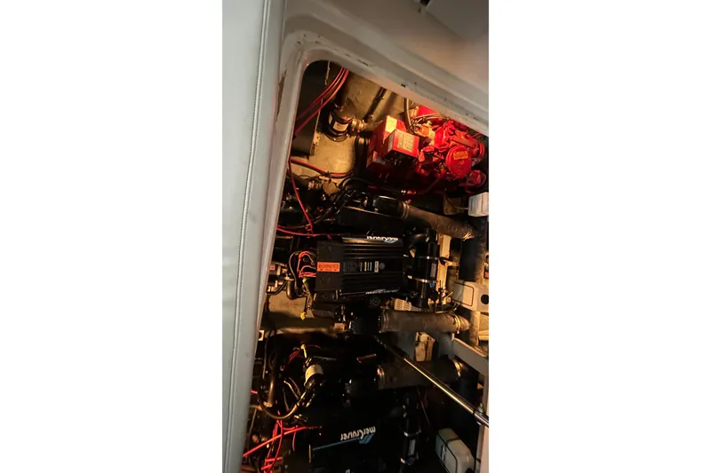 Slide: The Image of Engine compartment of a 1997 Sea Ray Sundancer 330 boat, featuring MerCruiser components. - 35