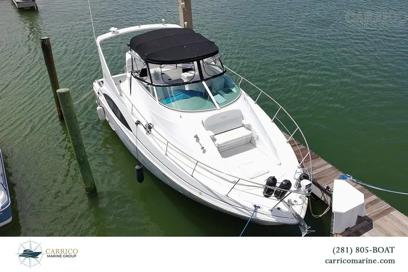 The Image of Carver 350 Mariner 2000 yacht docked at marina, featuring sleek design and spacious deck. - 0