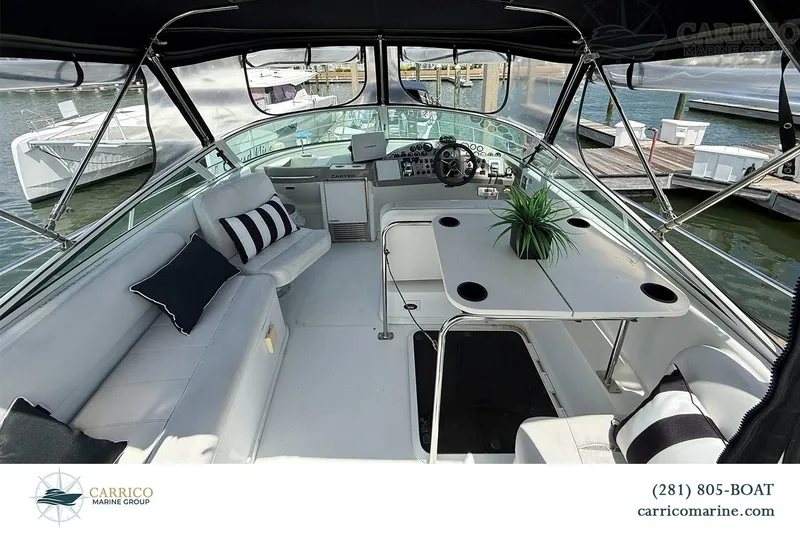 Slide: The Image of Interior view of a 2000 Carver 350 Mariner yacht with seating and helm. - 14