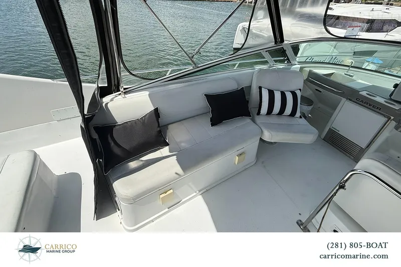 Slide: The Image of Interior view of 2000 Carver 350 Mariner yacht with seating and cushions. - 15