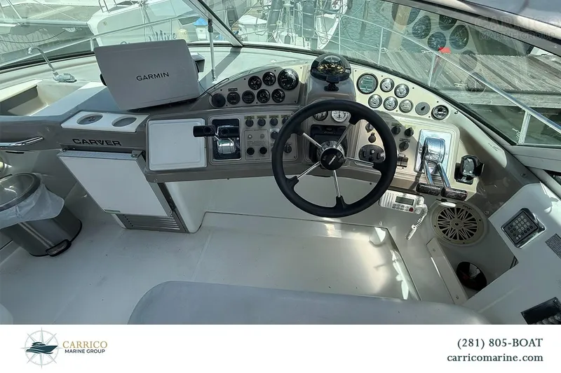 Slide: The Image of Cockpit of 2000 Carver 350 Mariner with Garmin navigation system and steering wheel. - 17