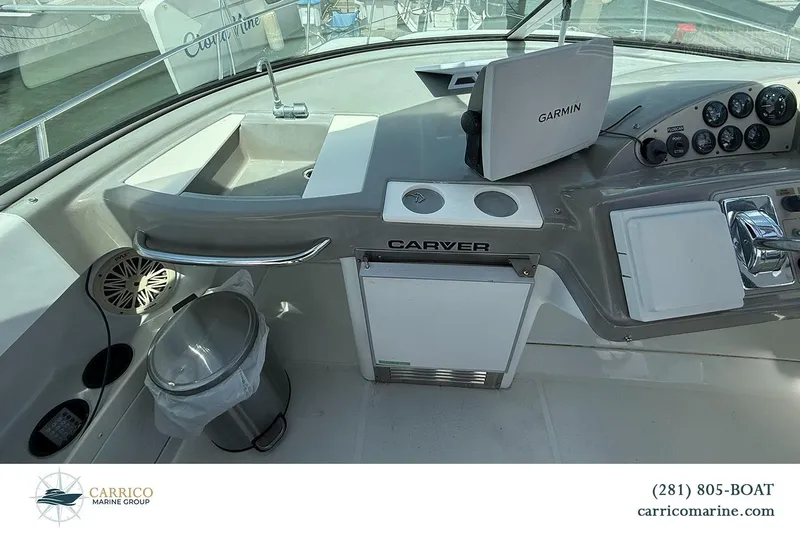 Slide: The Image of Cockpit of 2000 Carver 350 Mariner with Garmin navigation system and control panel. - 18