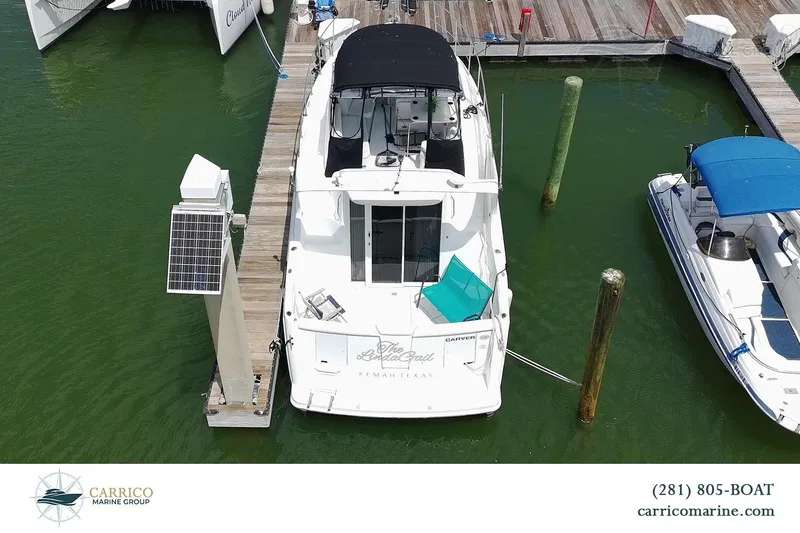 Slide: The Image of Aerial view of 2000 Carver 350 Mariner docked at marina. - 2